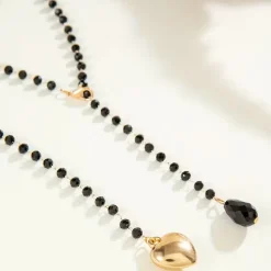 Μακρύ Κολιέ Lariat από Μαύρες Χάντρες με Χρυσή Καρδιά
