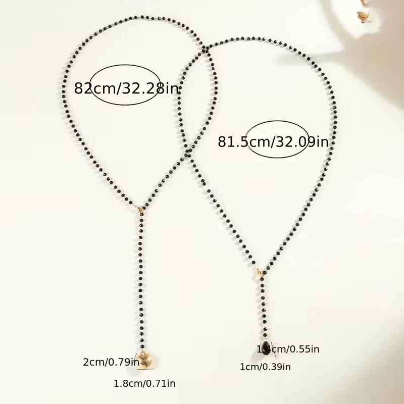 Μακρύ Κολιέ Lariat από Μαύρες Χάντρες με Χρυσή Καρδιά