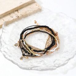 Σετ 8 Boho Βραχιόλια με Χάντρες και Χρυσές Λεπτομέρειες - Μαύρο & Beige