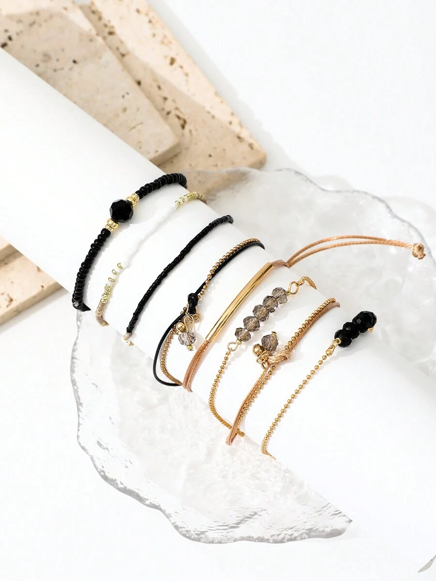 Σετ 8 Boho Βραχιόλια με Χάντρες και Χρυσές Λεπτομέρειες - Μαύρο & Beige