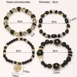 Σετ 4 Γυναικεία Βραχιόλια με Μαύρες Χάντρες και Χρυσό Μοτίφ