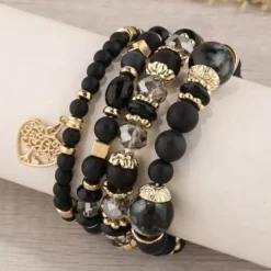 Σετ 4 Γυναικεία Βραχιόλια με Μαύρες Χάντρες και Χρυσό Μοτίφ
