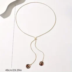 Χρυσό μακρύ κολιέ Y-Lariat με στρογγυλά leopard στοιχεία