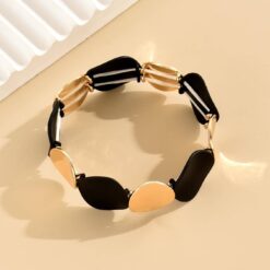 Αποκτήστε το πιο κομψό ελαστικό γυναικείο βραχιόλι με χρυσούς και μαύρους δίσκους. Μοντέρνο design και άνετη εφαρμογή για κάθε περίσταση. Δωρεάν αποστολή!