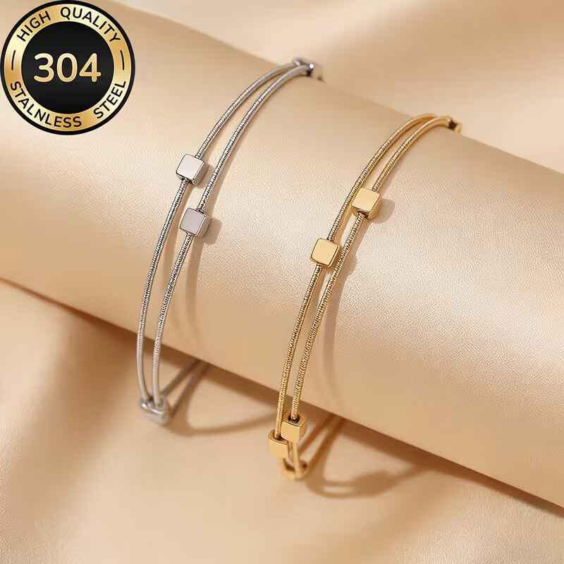 Γυναικείο διπλό βραχιόλι από χρυσό και ασημί ανοξείδωτο ατσάλι 304 με κύβους.