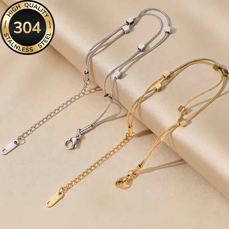 Γυναικείο διπλό βραχιόλι από χρυσό και ασημί ανοξείδωτο ατσάλι 304 με κύβους.