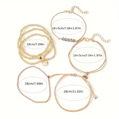 Γυναικείο σετ με 7 boho βραχιόλια σε χρυσό χρώμα με καρδιά και κρύσταλλα.