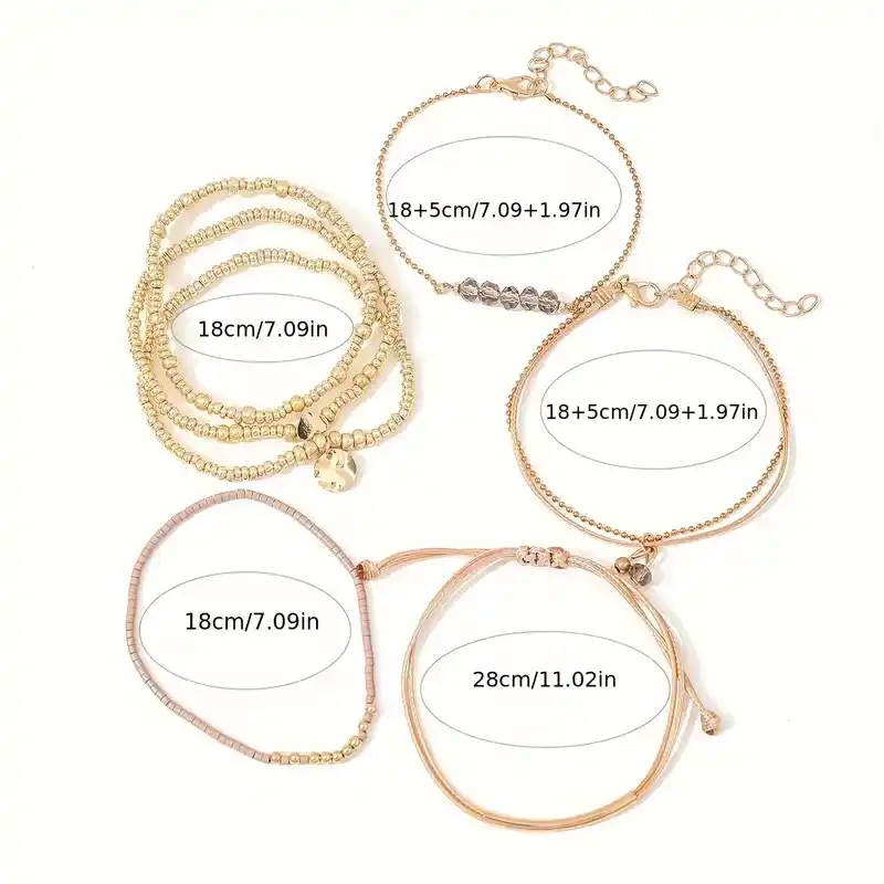 Γυναικείο σετ με 7 boho βραχιόλια σε χρυσό χρώμα με καρδιά και κρύσταλλα.