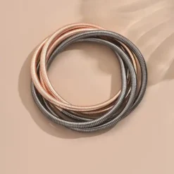 ελαστικών μεταλλικών βραχιολιών με πλέξη snake bone σε χρυσό, ασημί και ροζ χρυσό χρώμα