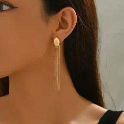 Χρυσά μακριά σκουλαρίκια με οβάλ βάση και πέντε κρεμαστές αλυσίδες τύπου snake chain