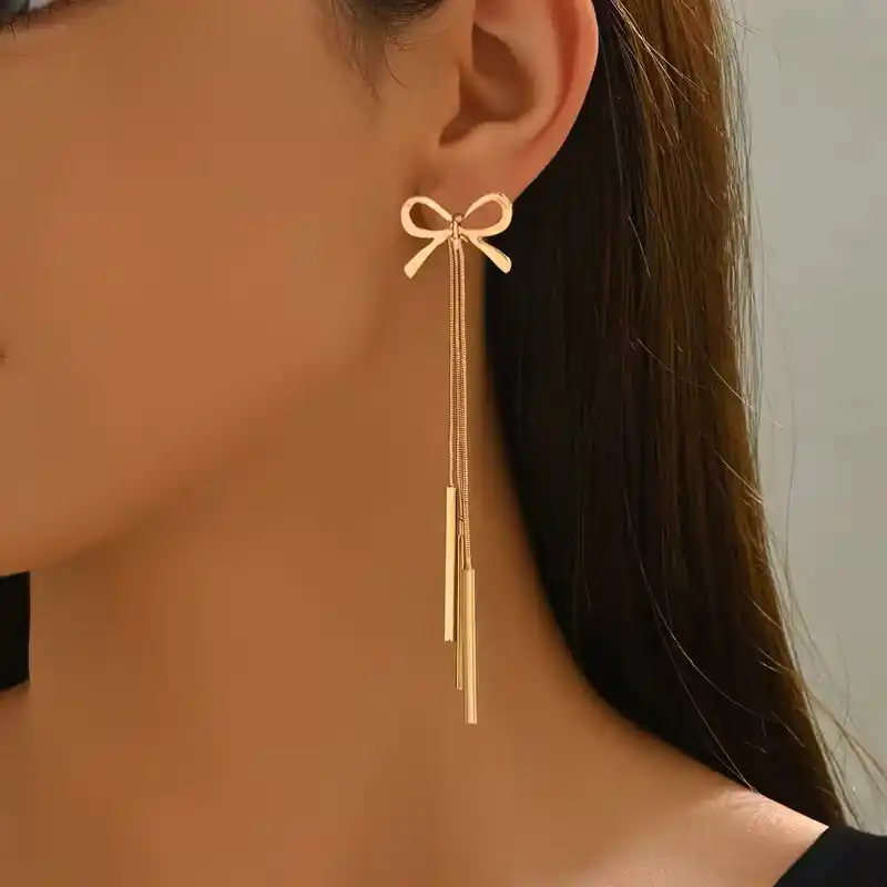 Χρυσά μακριά σκουλαρίκια 10 εκατοστών με σχέδιο φιόγκο και τρεις κρεμαστές λεπτές μπάρες