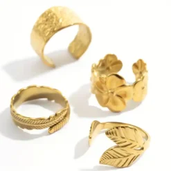 Σετ τέσσερα χρυσά ανοιγόμενα δαχτυλίδια από ανοξείδωτο ατσάλι με σχέδια φύλλα και λουλούδια