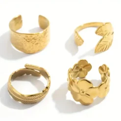 Σετ τέσσερα χρυσά ανοιγόμενα δαχτυλίδια από ανοξείδωτο ατσάλι με σχέδια φύλλα και λουλούδια